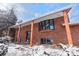 Brick home with covered front porch and stylish windows, offering a welcoming curb appeal and architectural detail at 255 Iroquois Dr, Boulder, CO 80303