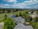 An aerial view of a neighborhood homes backing onto a grassy common area at 9079 Garnet St, Highlands Ranch, CO 80126