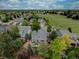 An aerial view of neighborhood homes backing onto a fenced green space at 9079 Garnet St, Highlands Ranch, CO 80126