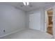 Neutral bedroom with a closet and view into the hallway at 9079 Garnet St, Highlands Ranch, CO 80126