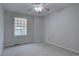 Neutral bedroom with a ceiling fan and window providing natural light at 9079 Garnet St, Highlands Ranch, CO 80126
