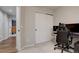 Comfortable bedroom with sliding door closet, plush carpet, and convenient desk area at 9079 Garnet St, Highlands Ranch, CO 80126