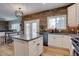 Stylish kitchen featuring an island with bar seating and stainless steel appliances at 9079 Garnet St, Highlands Ranch, CO 80126