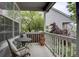 Cozy covered porch with outdoor seating, perfect for enjoying a peaceful view of the landscaped yard at 9079 Garnet St, Highlands Ranch, CO 80126