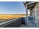 Private front patio with distant open space views at 12713 Leyden St # F, Thornton, CO 80602