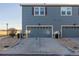 Attached two-car garage with driveway parking at 12713 Leyden St # F, Thornton, CO 80602