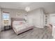 Main bedroom showcasing a luxurious bed, ample natural light, and high ceilings at 12713 Leyden St # F, Thornton, CO 80602