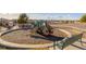 Community playground with playset and bench at 12713 Leyden St # F, Thornton, CO 80602