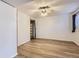 Spacious bedroom with laminate floors, closet, and fan at 7665 E Eastman Ave # 106A, Denver, CO 80231