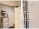 Well-organized closet with shelving, storage space, and hot water tank at 7665 E Eastman Ave # 106A, Denver, CO 80231