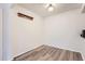 A cozy dining area showcases laminate flooring and a charming wall rack at 7665 E Eastman Ave # 106A, Denver, CO 80231