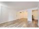 Bright living room featuring wood floors, a front door to the outside, and a coat rack at 7665 E Eastman Ave # 106A, Denver, CO 80231
