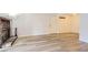 Bright living room featuring wood floors, a brick fireplace, and a front door to the outside at 7665 E Eastman Ave # 106A, Denver, CO 80231