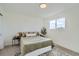 Cozy bedroom with green bedding and a window offering natural light at 9749 Steele St, Thornton, CO 80229