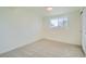 Bright bedroom featuring neutral carpeting and a window at 9749 Steele St, Thornton, CO 80229