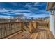 Back deck with wooden railings and stairs leading to yard at 9749 Steele St, Thornton, CO 80229