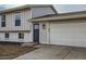 Newly remodeled home featuring a charming front door and attached garage at 9749 Steele St, Thornton, CO 80229