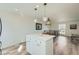 Stylish kitchen island with white cabinets and quartz countertops at 9749 Steele St, Thornton, CO 80229