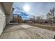 Concrete patio area adjacent to deck and backyard at 9749 Steele St, Thornton, CO 80229