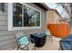 Cozy patio seating area with cushioned chairs and outdoor grill at 20715 Bridlewood Ln, Parker, CO 80138