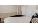 Bright bedroom featuring a white comforter, closet, and an open door that provides depth at 20715 Bridlewood Ln, Parker, CO 80138