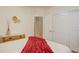 Bright bedroom featuring a white comforter, closet, and light neutral tones at 20715 Bridlewood Ln, Parker, CO 80138
