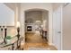 Elegant entryway showcasing hardwood floors and an arched doorway leading into the living room at 20715 Bridlewood Ln, Parker, CO 80138
