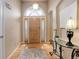 Welcoming entryway with hardwood floors, decorative lighting, and a stylish console table at 20715 Bridlewood Ln, Parker, CO 80138