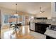 Spacious kitchen with dark cabinets, stainless steel appliances, breakfast nook, and natural lighting at 20715 Bridlewood Ln, Parker, CO 80138
