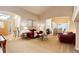 Open-concept living room and dining area with modern furnishings and plenty of space at 20715 Bridlewood Ln, Parker, CO 80138