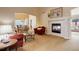 Spacious living room with a fireplace, dining area, and large windows offering natural light at 20715 Bridlewood Ln, Parker, CO 80138