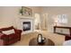 Cozy living room featuring a fireplace and comfortable seating, perfect for relaxing at 20715 Bridlewood Ln, Parker, CO 80138