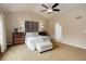 Primary bedroom with vaulted ceilings, dual sconces and ensuite bath access at 20715 Bridlewood Ln, Parker, CO 80138