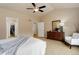 Primary bedroom with vaulted ceilings and ensuite bathroom access and walk-in closet at 20715 Bridlewood Ln, Parker, CO 80138