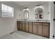 Elegant bathroom with double sinks, granite countertops, and modern fixtures at 16818 E 119Th Ave # A, Commerce City, CO 80022