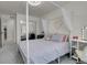 Bedroom featuring a stylish four-poster bed, decor and closet with mirrored doors at 16818 E 119Th Ave # A, Commerce City, CO 80022