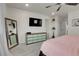 Bright bedroom with dresser and a large mirror at 16818 E 119Th Ave # A, Commerce City, CO 80022