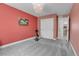 Spacious bedroom with soft carpet, a chandelier, and a closet at 16818 E 119Th Ave # A, Commerce City, CO 80022