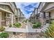 Street view featuring townhomes with unique color schemes, stylish accents, and community appeal at 16818 E 119Th Ave # A, Commerce City, CO 80022