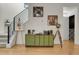 Open hallway with view of staircase and credenza at 16818 E 119Th Ave # A, Commerce City, CO 80022