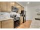 A well-equipped kitchen featuring stainless steel appliances and ample cabinet space at 16818 E 119Th Ave # A, Commerce City, CO 80022