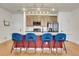 Bright kitchen with a central island featuring barstool seating and stylish pendant lighting at 16818 E 119Th Ave # A, Commerce City, CO 80022