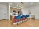 Charming kitchen with stainless steel appliances, a large island, and custom lighting fixtures at 16818 E 119Th Ave # A, Commerce City, CO 80022