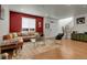 Inviting living room features hardwood floors, and a comfortable leather sectional perfect for relaxing or entertaining guests at 16818 E 119Th Ave # A, Commerce City, CO 80022