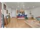Open-concept living area flowing into the kitchen, featuring hardwood floors and modern decor at 16818 E 119Th Ave # A, Commerce City, CO 80022