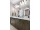 Bathroom with double sink vanity, lots of counter space and lighting at 16351 Askins Loop, Parker, CO 80134
