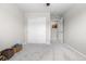 Bedroom with neutral walls, carpet, a closet with sliding doors, and a glimpse of the hallway at 16351 Askins Loop, Parker, CO 80134