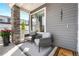 Cozy front porch featuring comfortable seating, decorative planters, and stylish exterior details at 16351 Askins Loop, Parker, CO 80134
