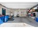 Spacious two-car garage with ample storage space and overhead lighting at 16351 Askins Loop, Parker, CO 80134