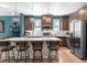 Modern kitchen with sleek countertops, stylish lighting, and stainless steel appliances at 16351 Askins Loop, Parker, CO 80134